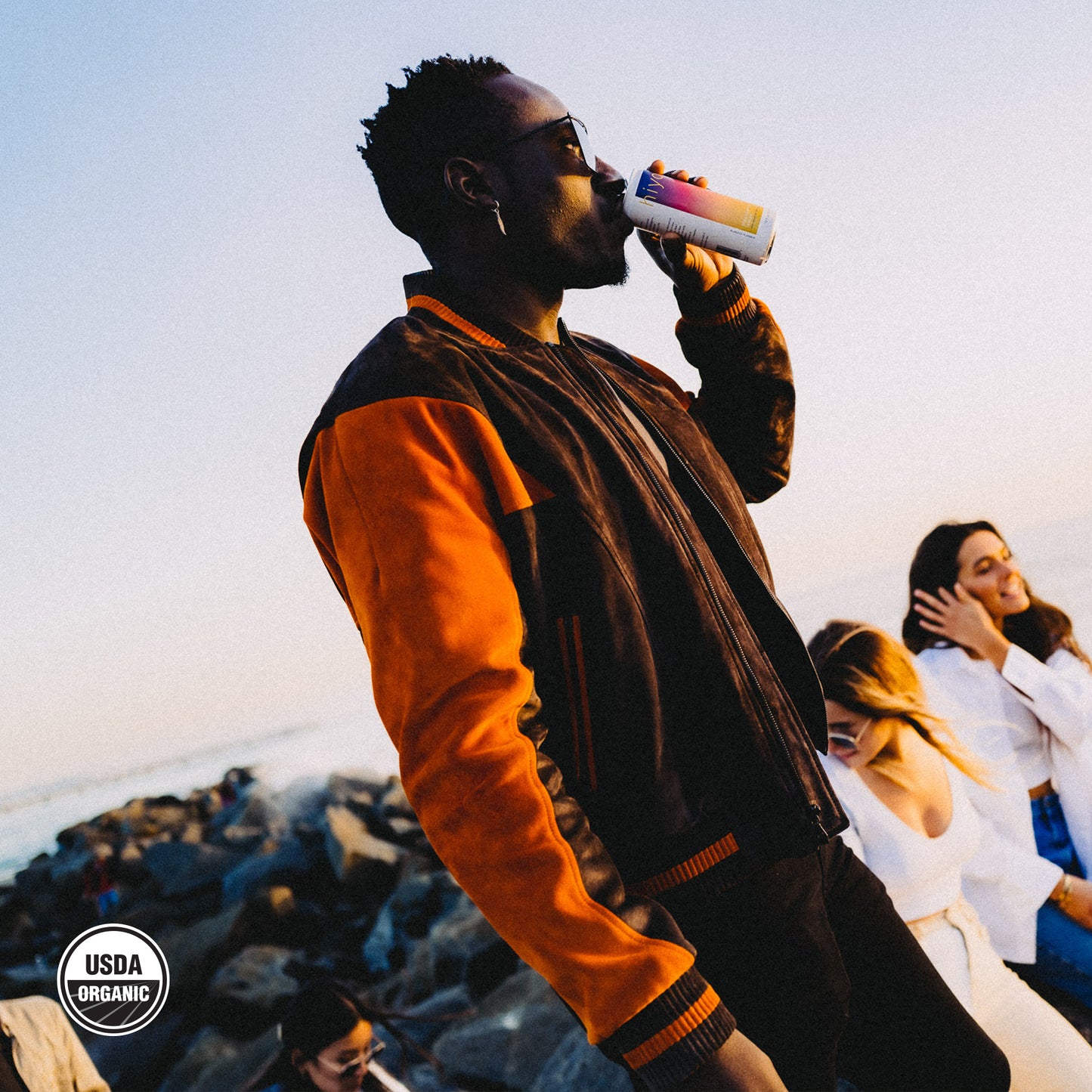 a man drinking a can of blackberry lemon