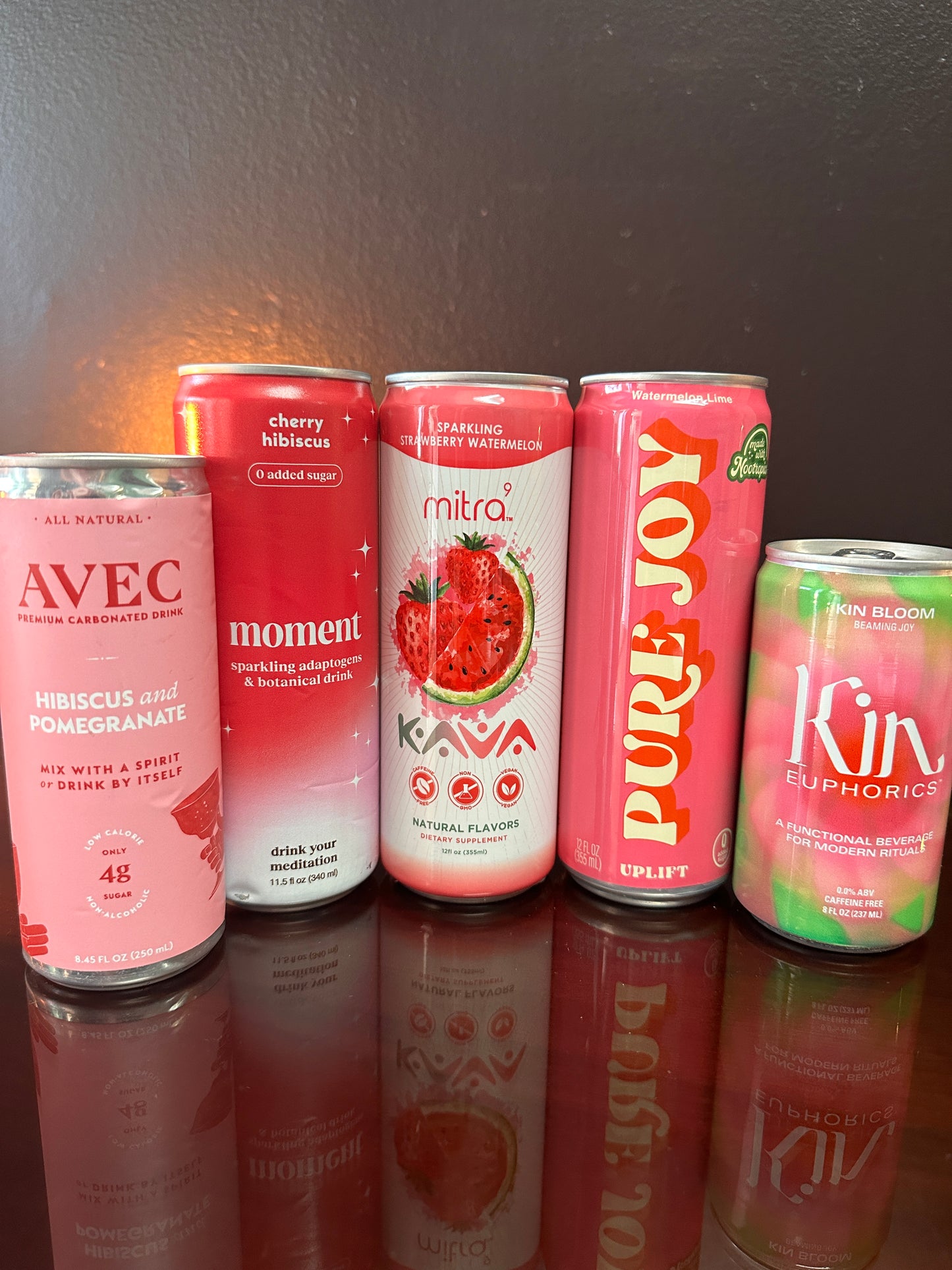 five drinks displayed next to eachother, they are all pink