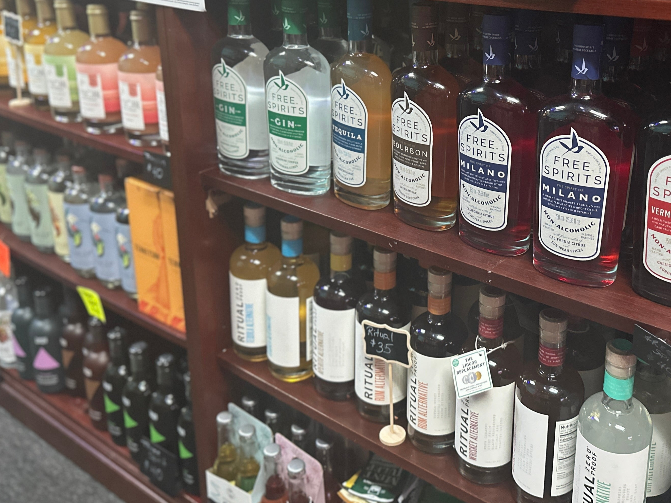 dynamic photo of the spirits shelf inside of the store.