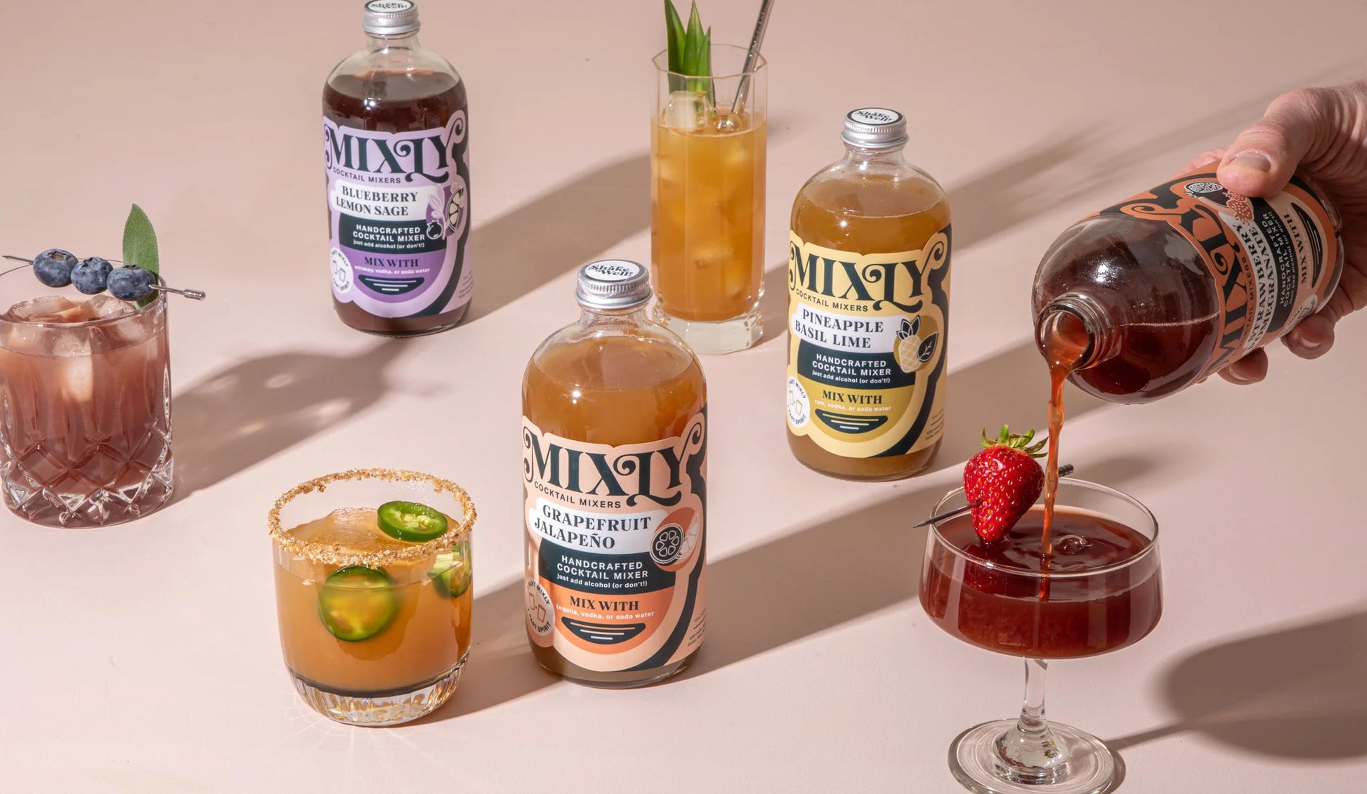 mixly bottles next to the drink in a glass