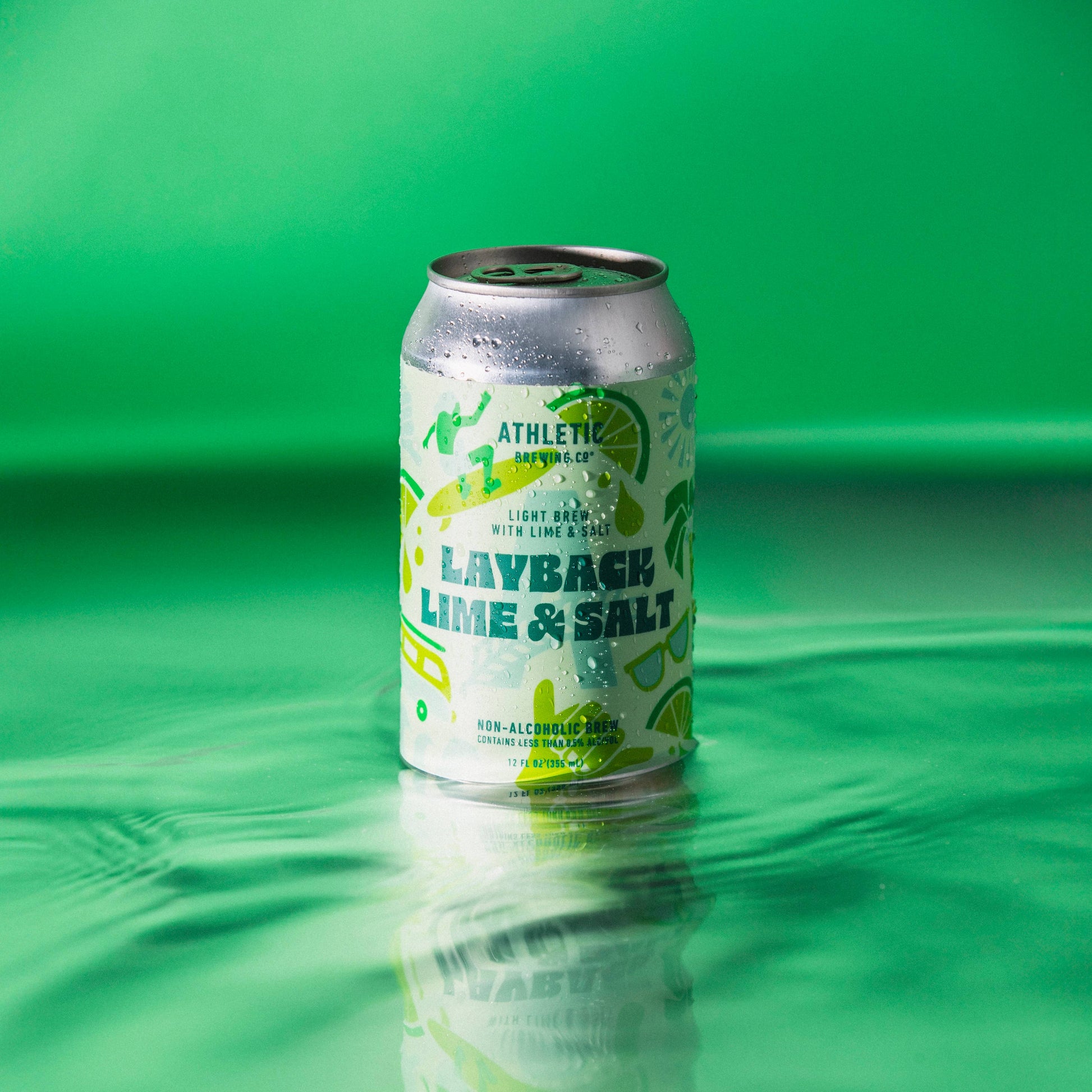 a can of layback lime & salt sitting on the surface of water with a deep green background