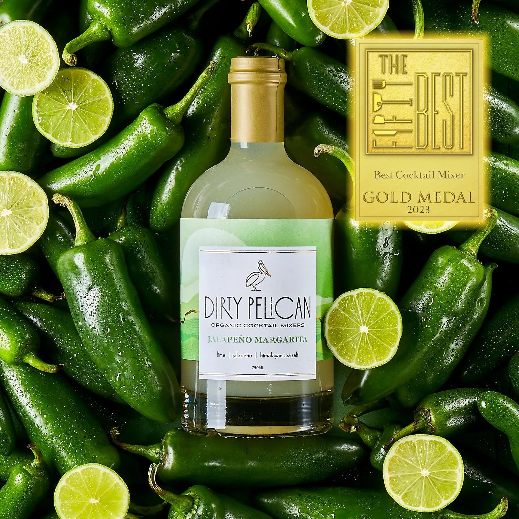 dirty pelican's jalapeño margarita bottle on a background of jalapeño peppers and lime slices
