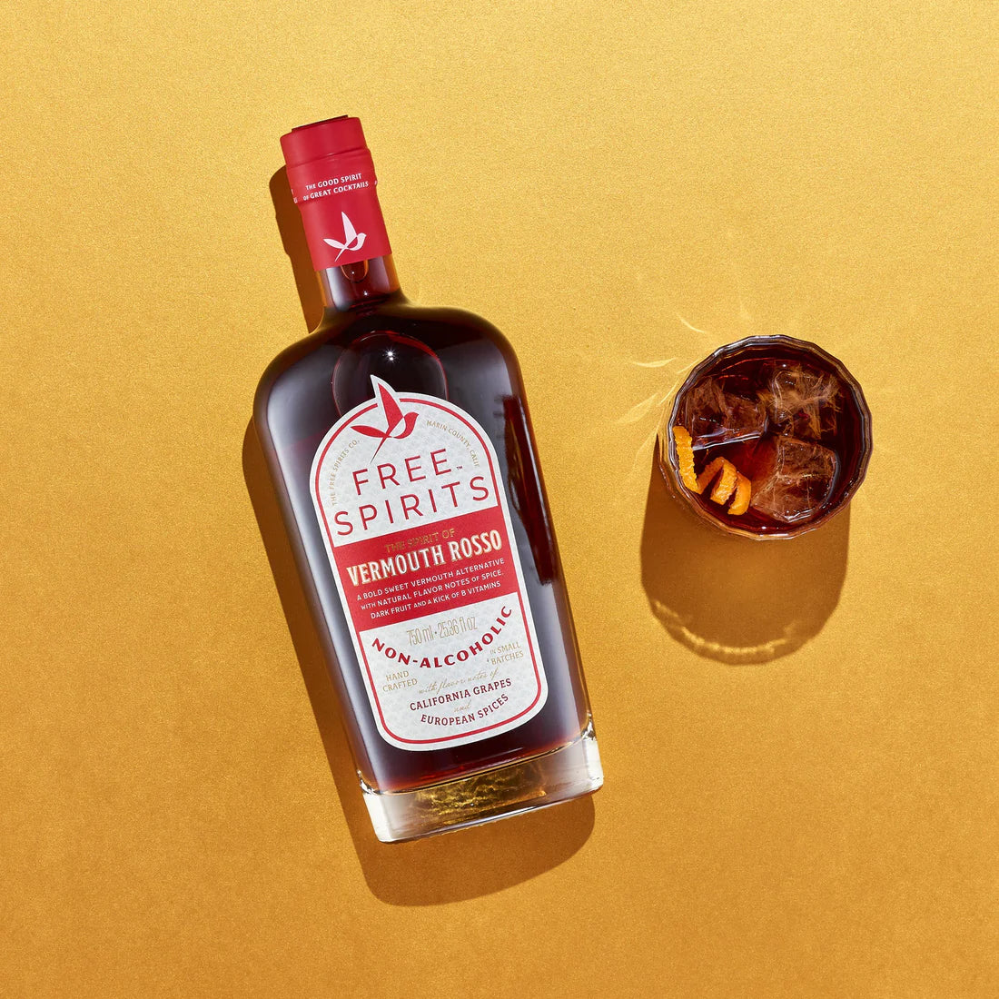a display of vermouth rosso next to a top down view of a glass on a yellow background