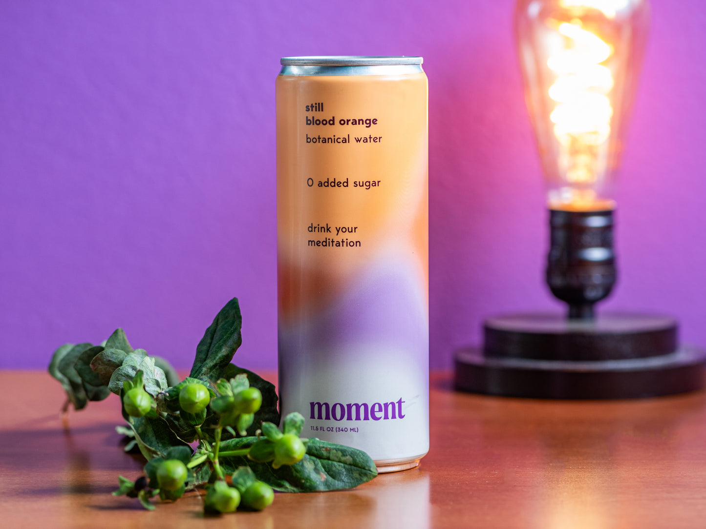 a can of blood orange displayed in front of a purple background