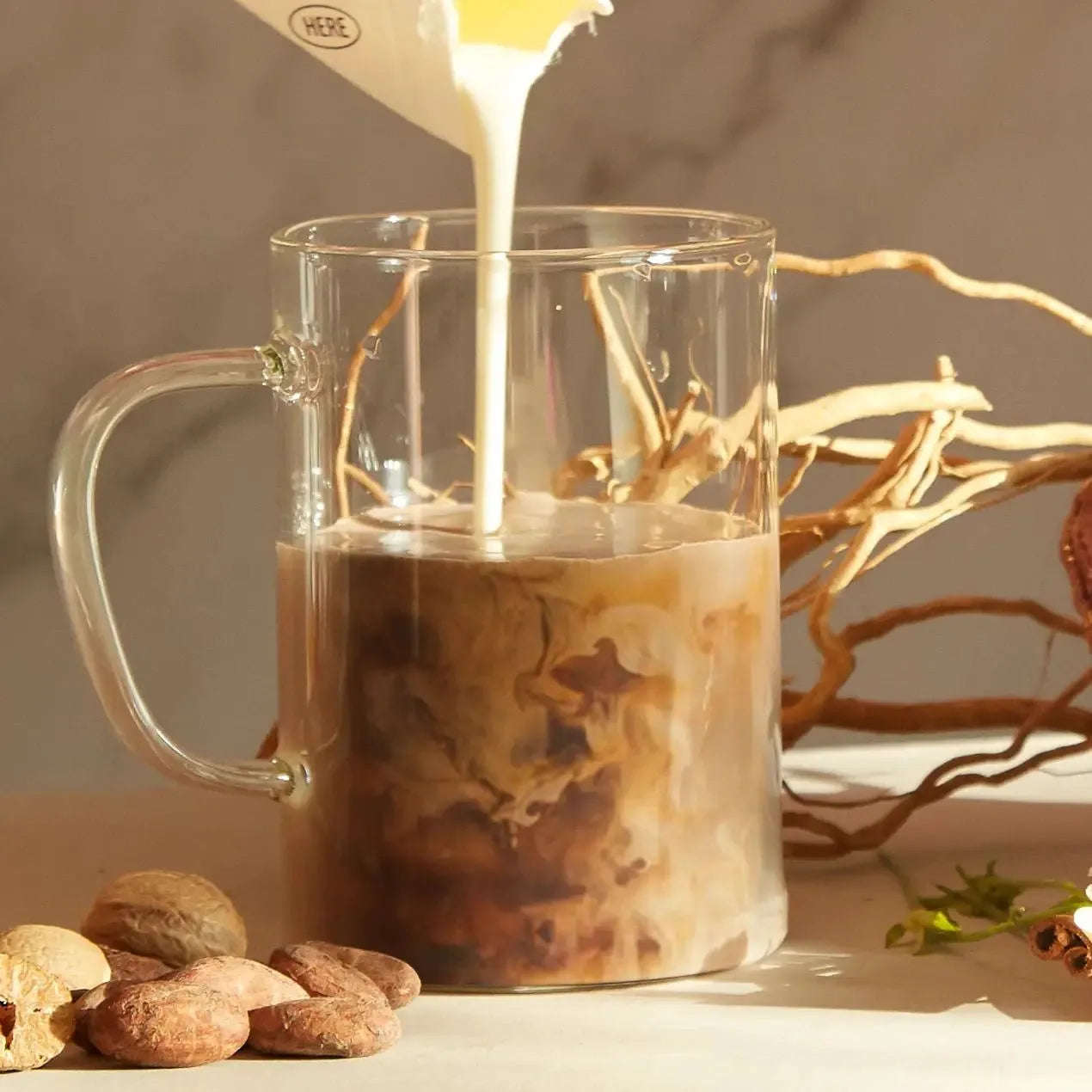 a glass mug of moment's cacao adaptogen blend