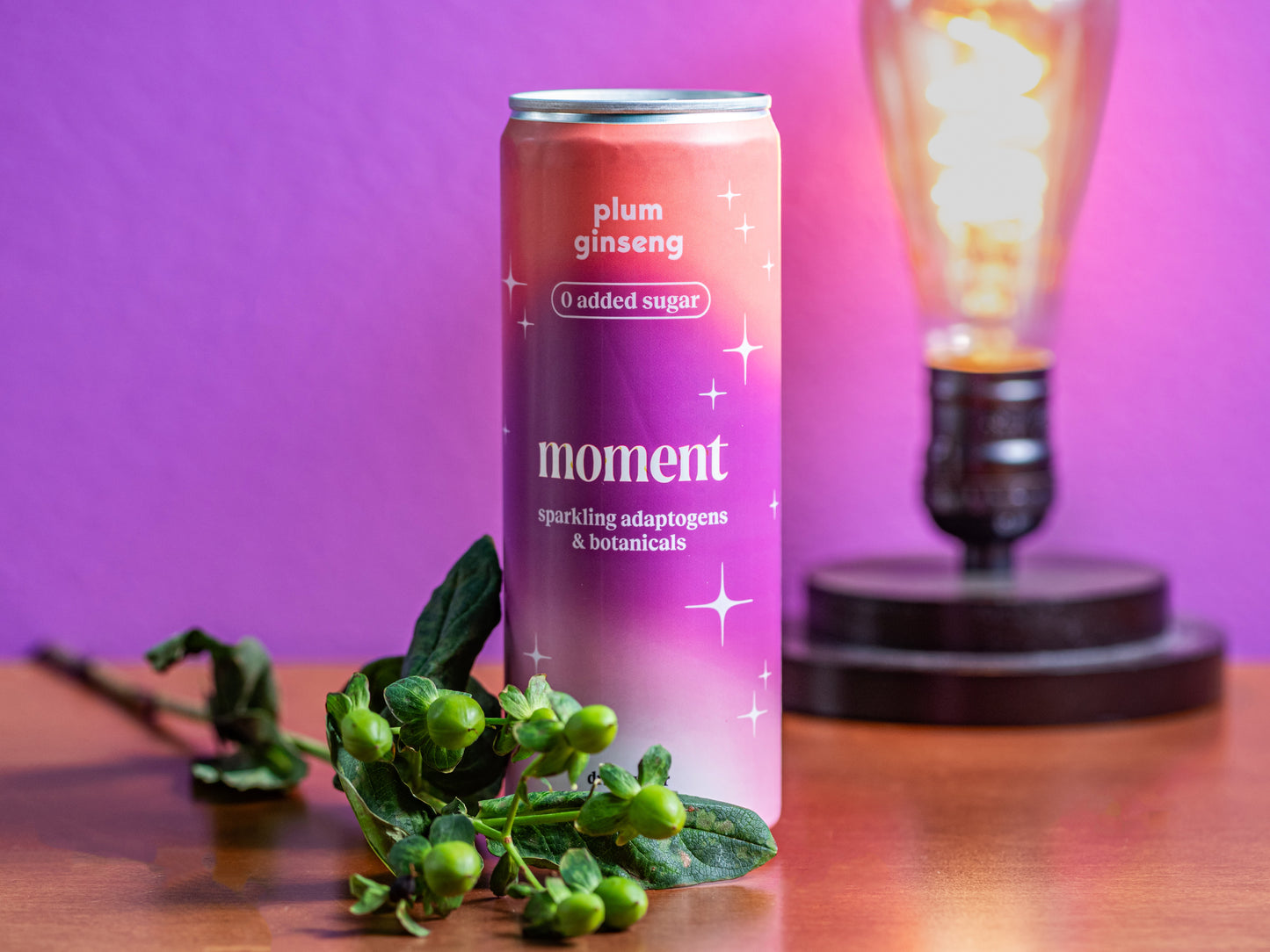 a can of moment's sparkling plum ginseng botanical water