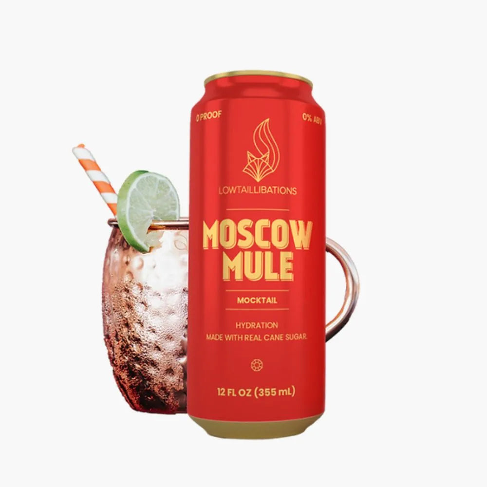 a can of moscow mule next to a full glass