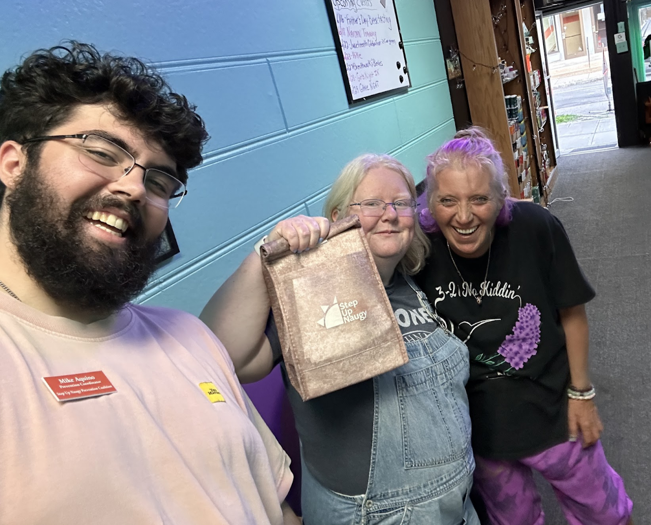 a photo of bobbie, a customer and mike from youth services posing fro a selfie after the youth services sponsored narcan training event