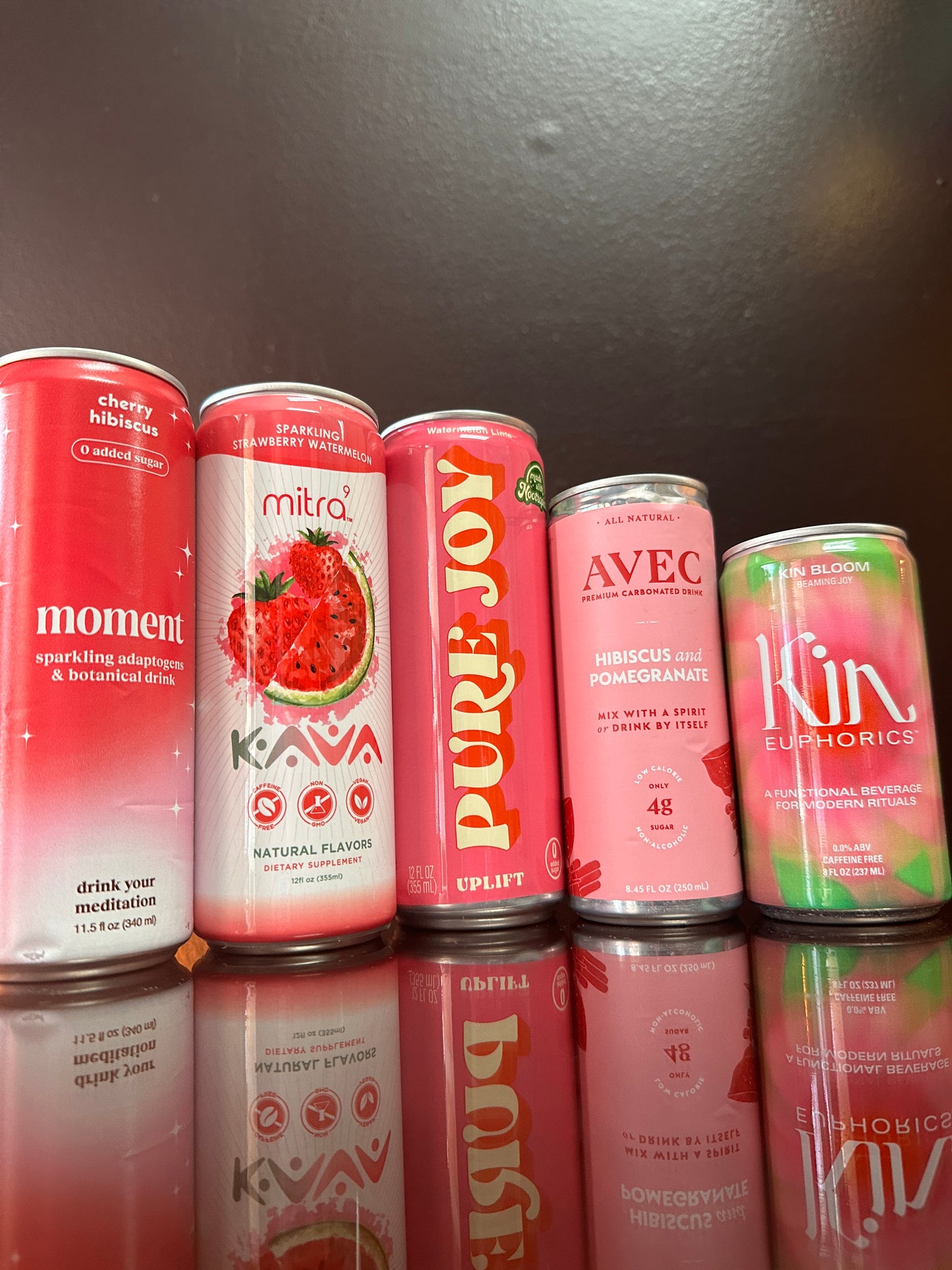 five drinks displayed next to eachother, they are all pink
