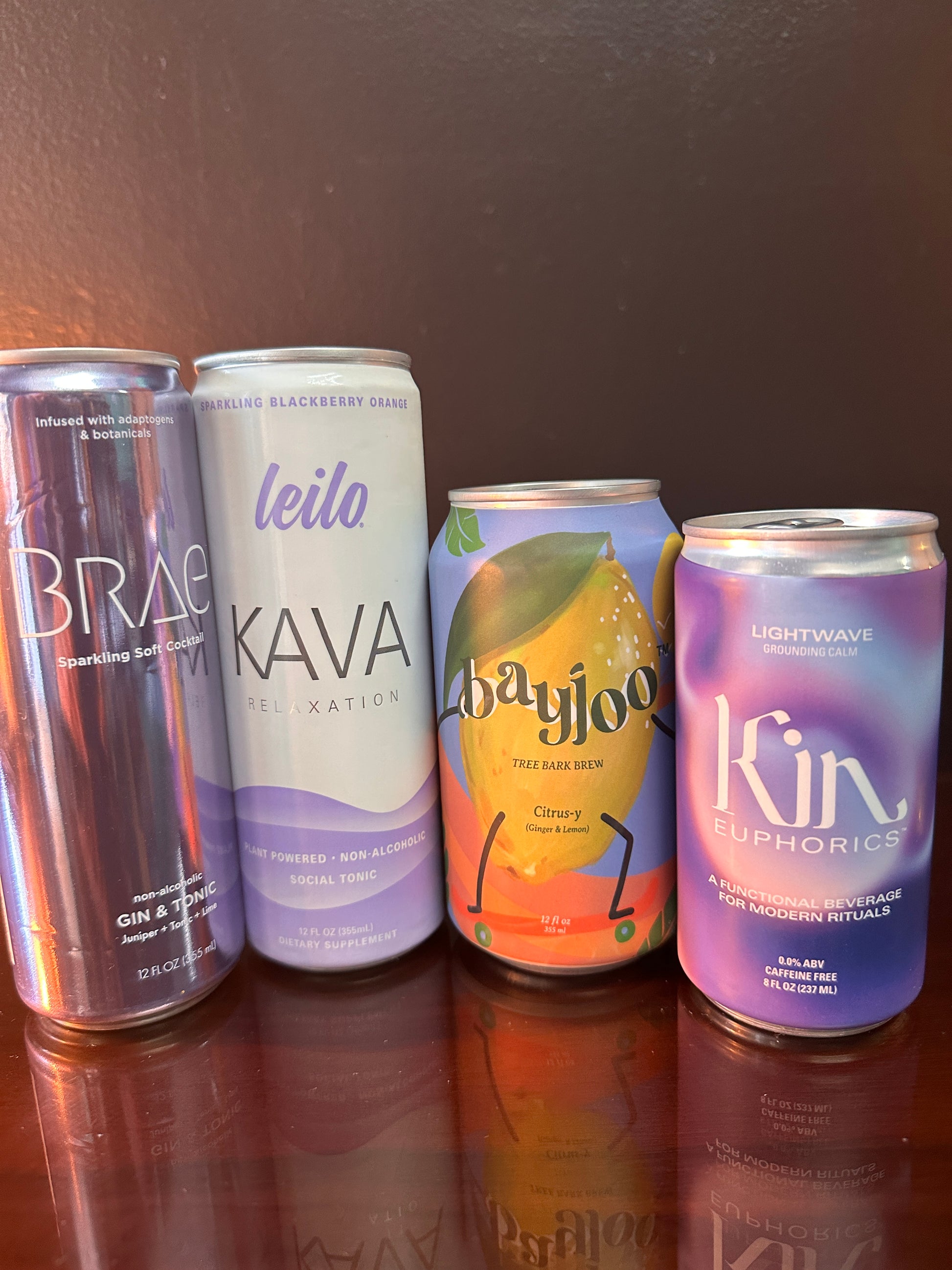 four drinks displayed next to eachother, they are all purple