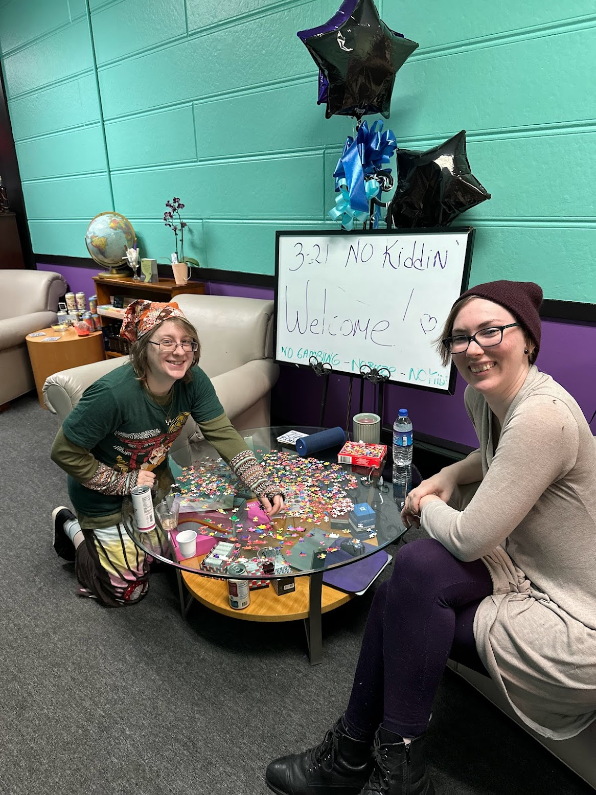 two customers working on a puzzle inside of the store